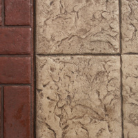 Close Up Photo Of A Basketweave Brick Border With 12X12 Tile Stamped Concrete.
