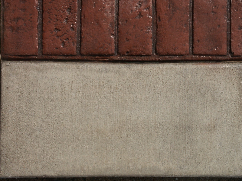 Closeup photo of a soldier course concrete stamp.
