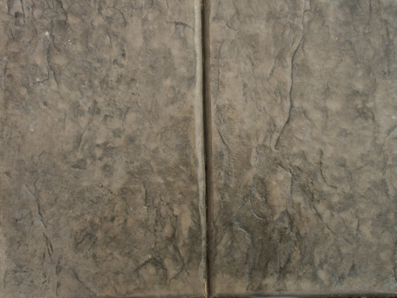 Closeup photo of a stone texture with tooled joint concrete stamp.