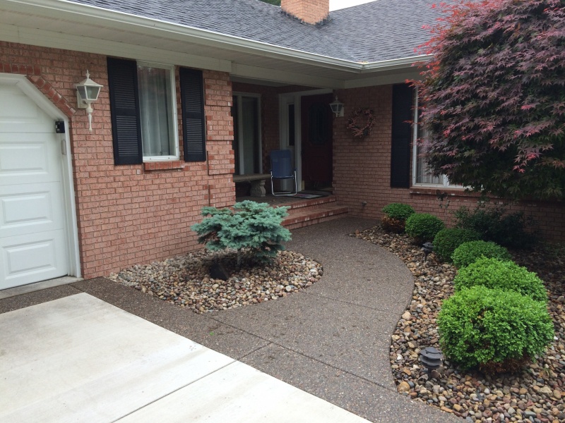 exposed aggregate entry walk way in front of a house