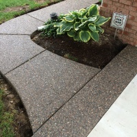 Exposed Aggregate Walkway On Side Of Home