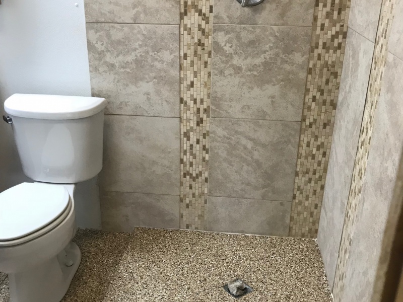 shower and restroom floor covered in poly coating
